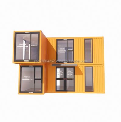 s モダンな二階建てのガラス壁 コンテナハウス 50/75/100mm ウォーブサンドイッチパネルを活用して 脱ぎ取れる折りたたみ可能な鋼製バン オフィス用