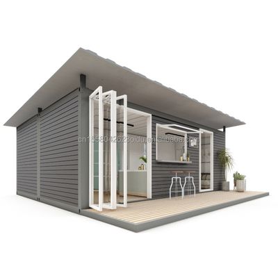 鉄鋼の折りたたみ 現代のデザイン 貨物用 プレファブリケートハウス コンテナ サンドイッチパネル モジュール型ショップ アパートメント